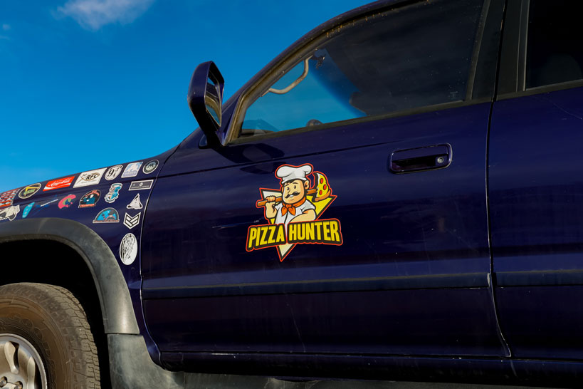 pizza hunter logo on car