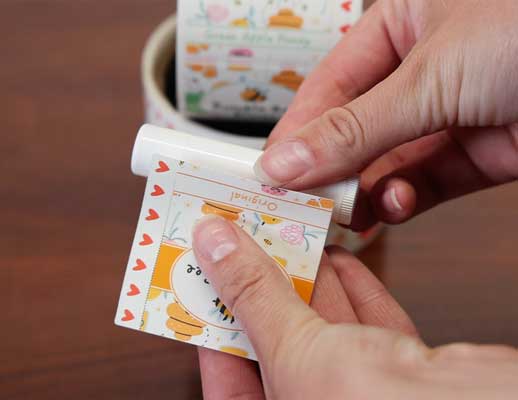 applying lip balm labels