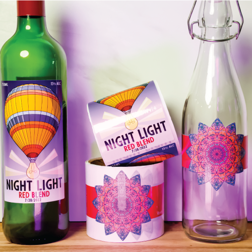 Night Light wine bottles showcasing their colorful and unique wine label sizes